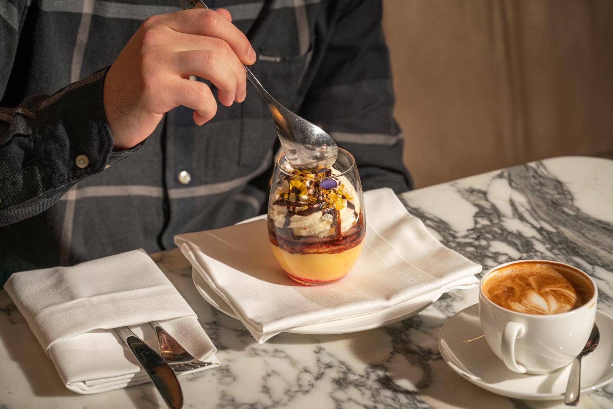 Sanderson Лондон Екстер'єр фото A man eating a dessert